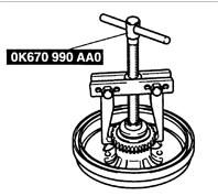 7. Специальным приспособлением ОК670 990 АА0 снимите ротор датчика ABS.